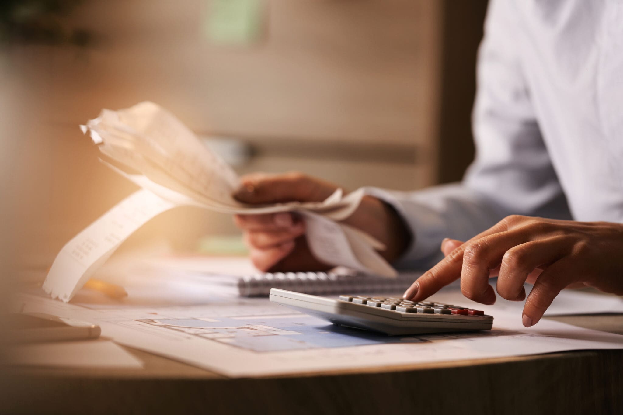 Close Up Of Business Accountant Using Calculator While Working