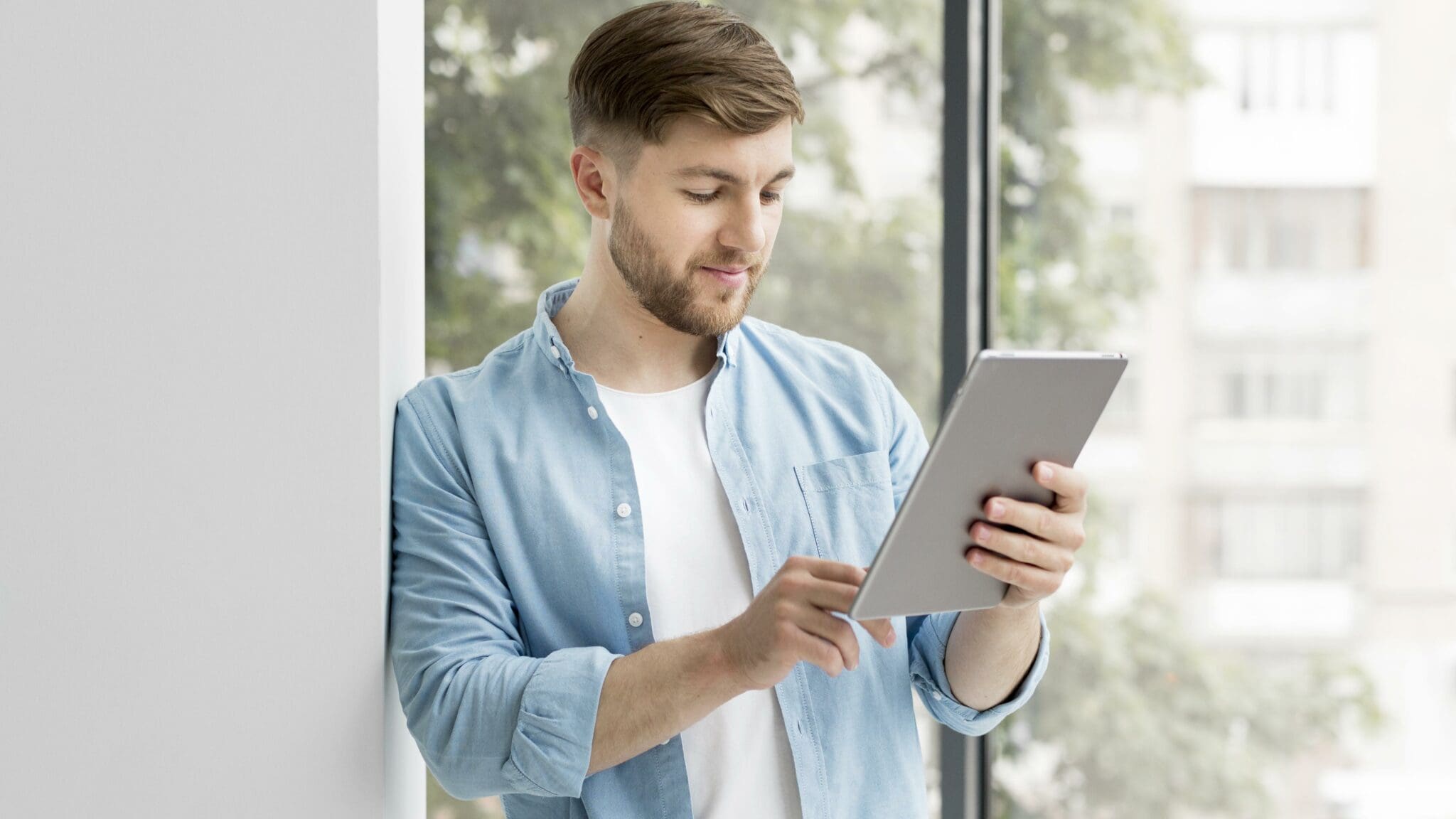 Man looking at a tablet