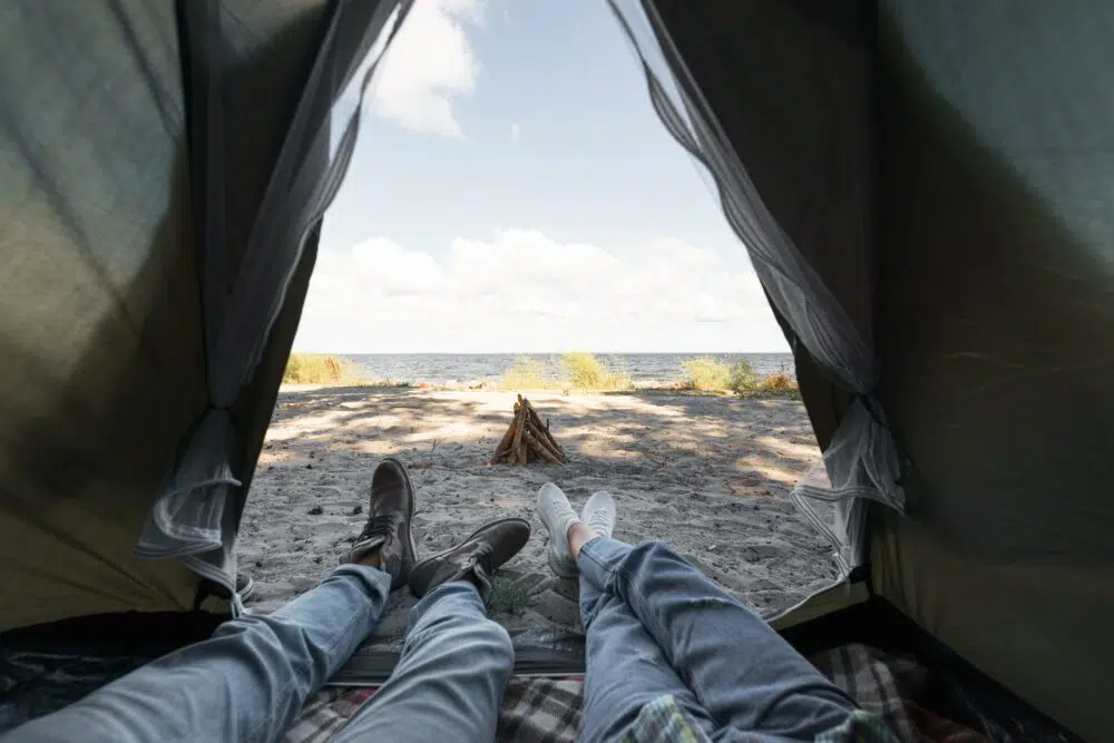two people inside a tent