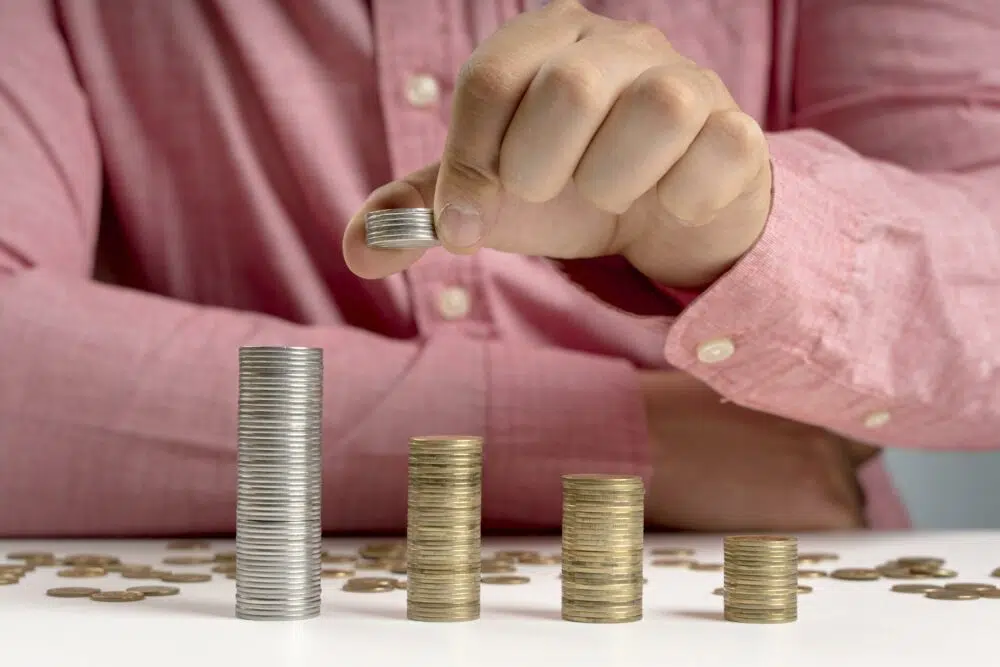 a man stacking coins