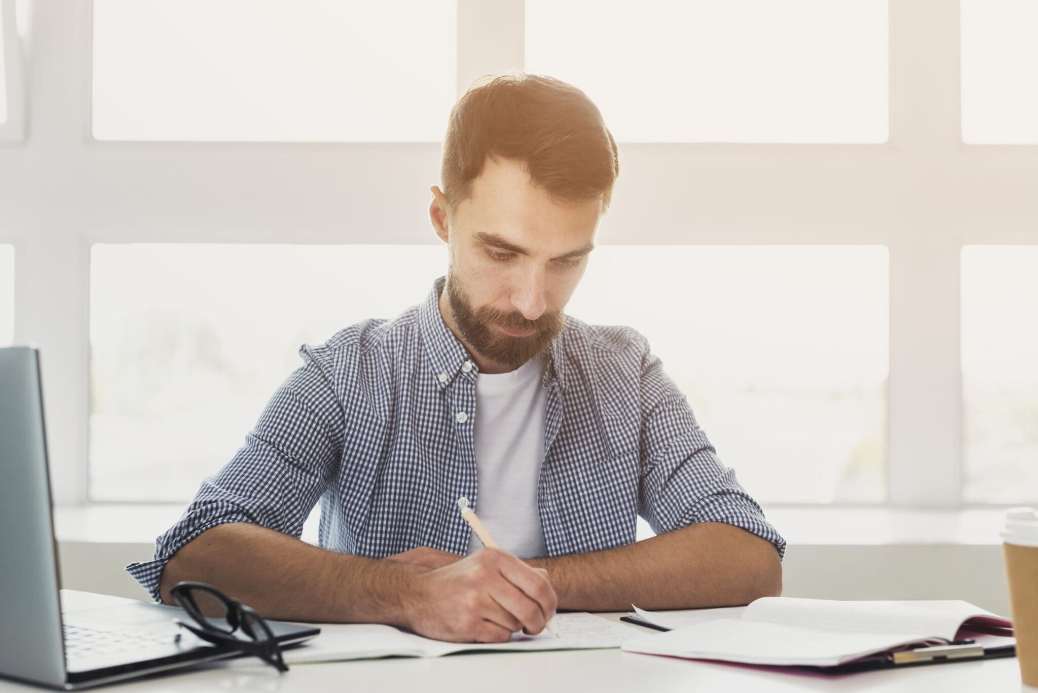 accountant working on a sheet of numbers