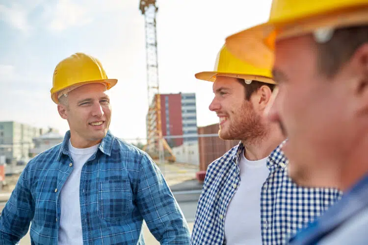 two construction workers talking