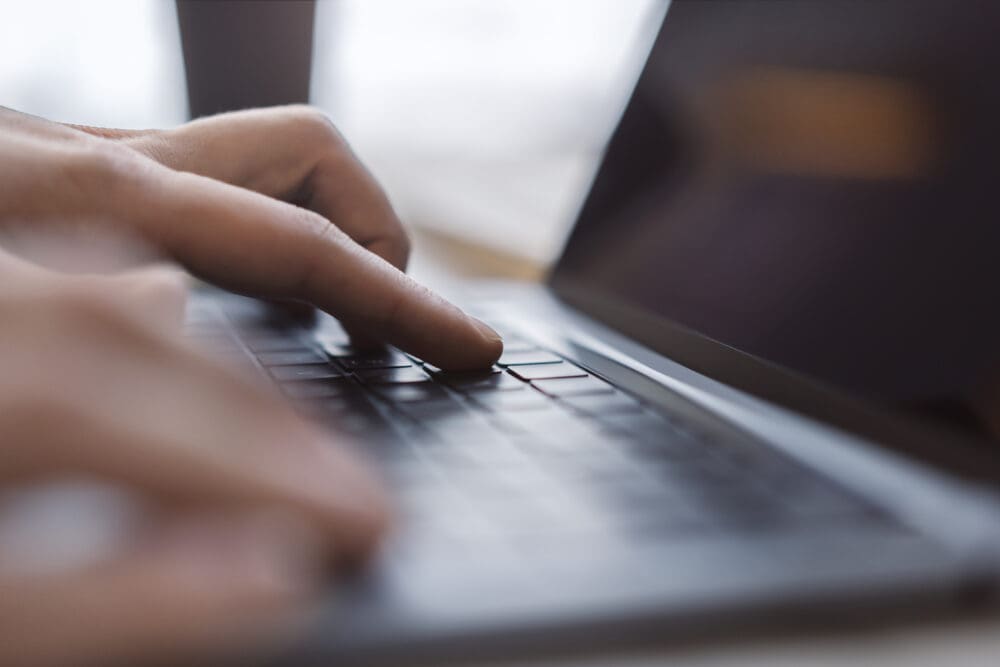 a close up of someone using a laptop