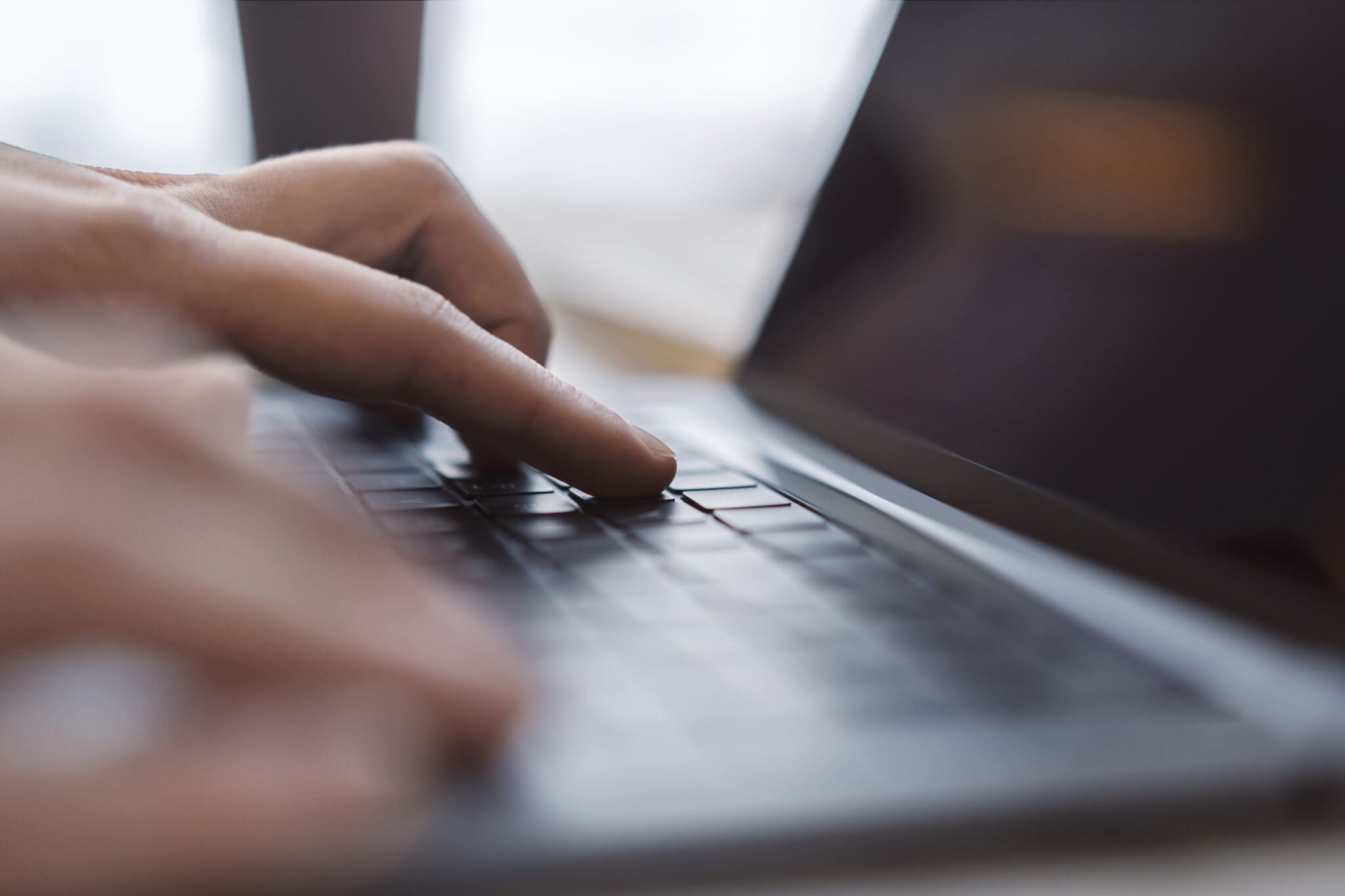 a close up of someone using a laptop
