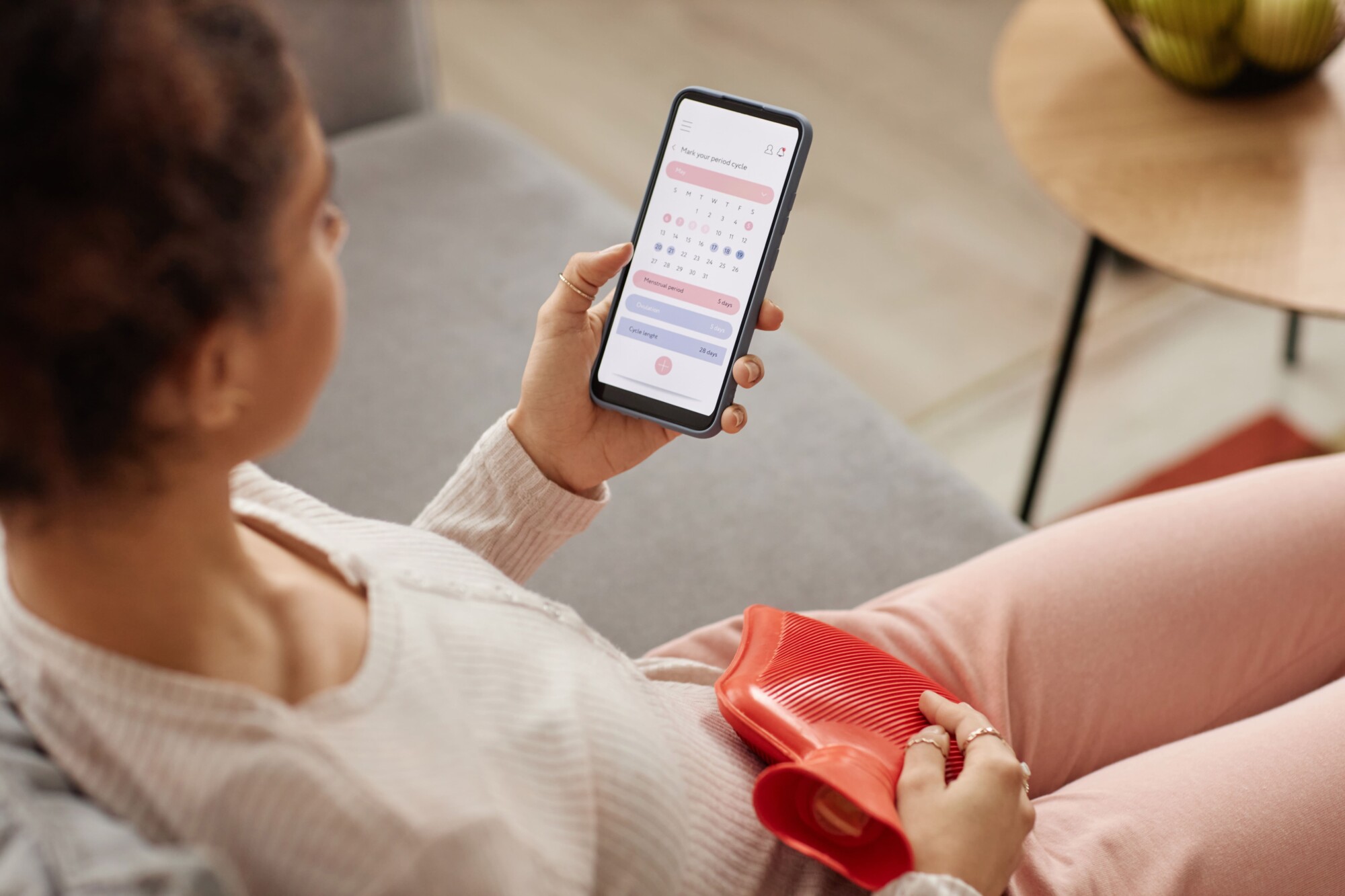 a woman checking a fertility app