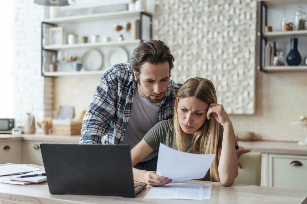 a couple reviewing tax documents