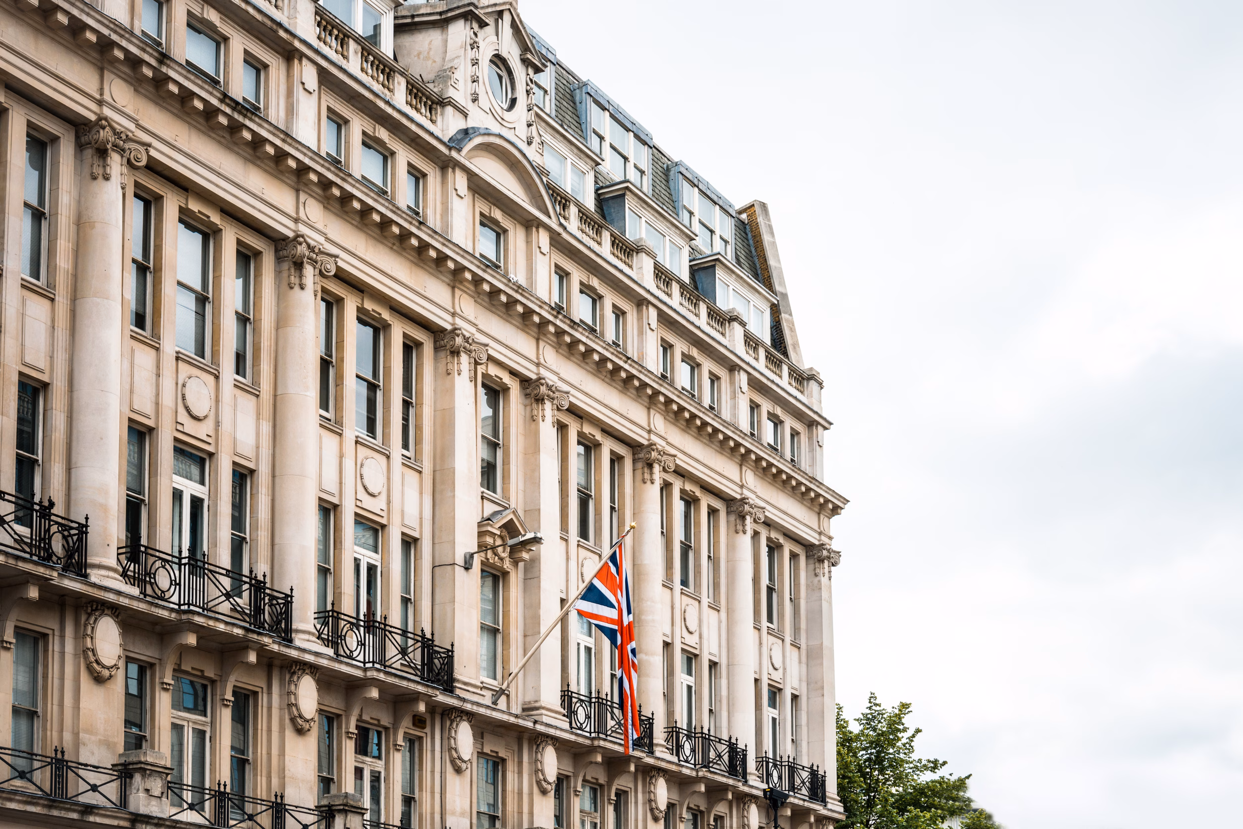 Traditional British building exterior with Union Jack flag, representing HMRC government offices in the UK