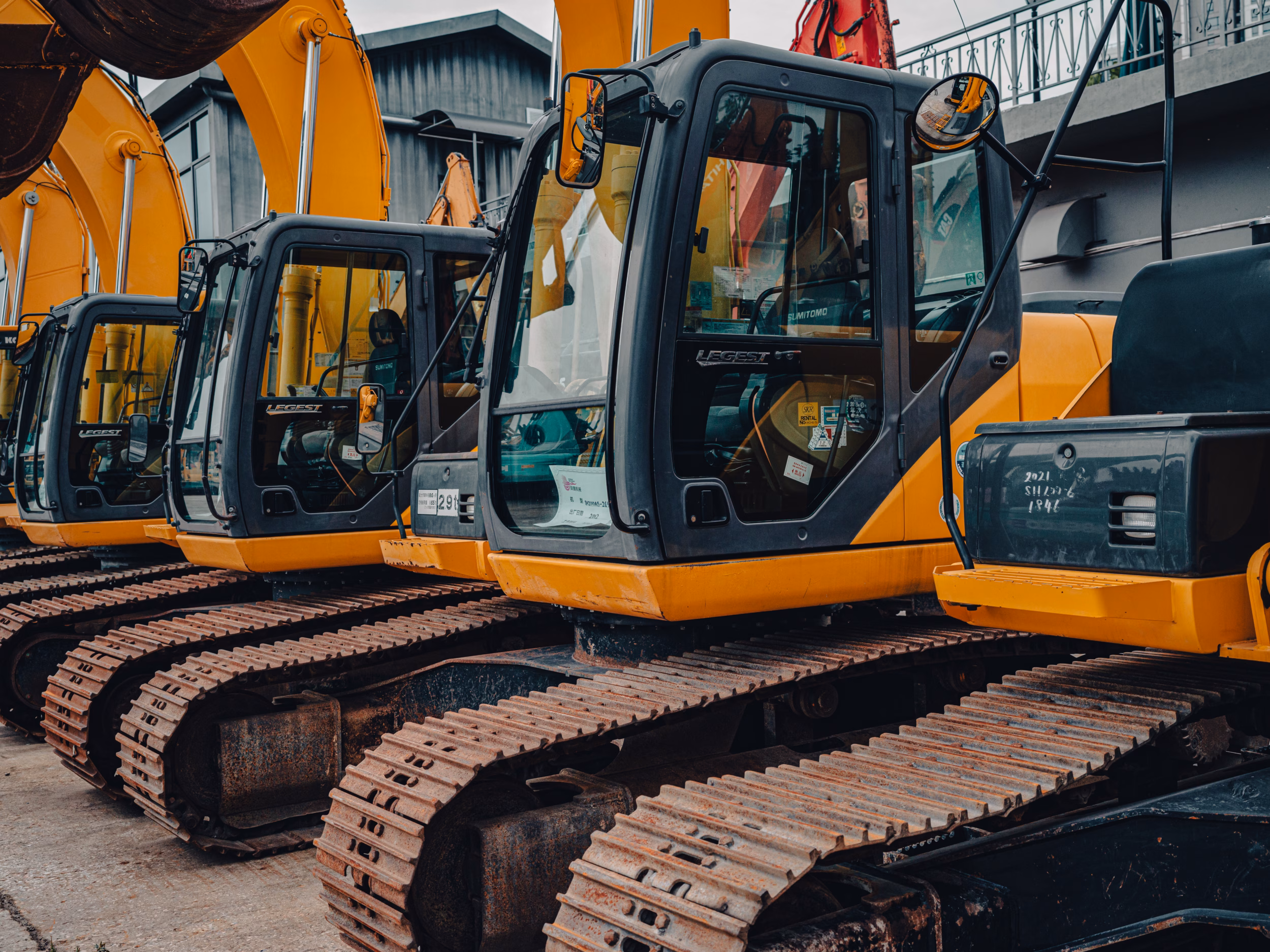 Row Of Yellow Excavators On A Construction Site