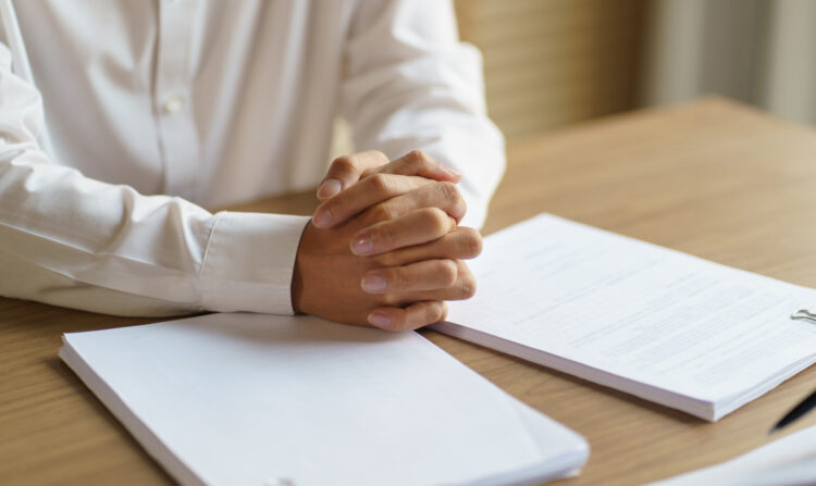 Estate executor reviewing HMRC correspondence about NI refund