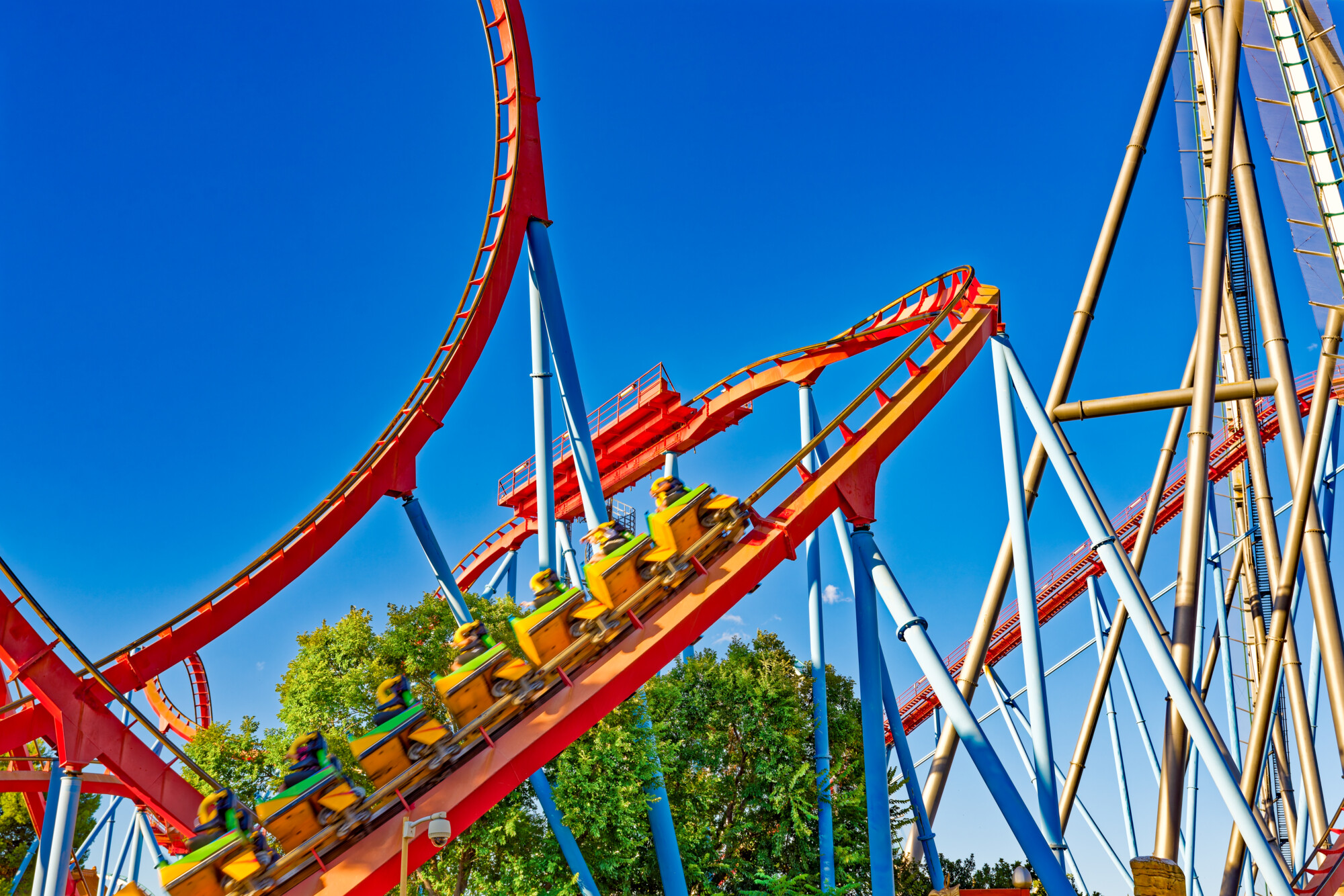 Theme park roller coaster representing summer holiday activities for children