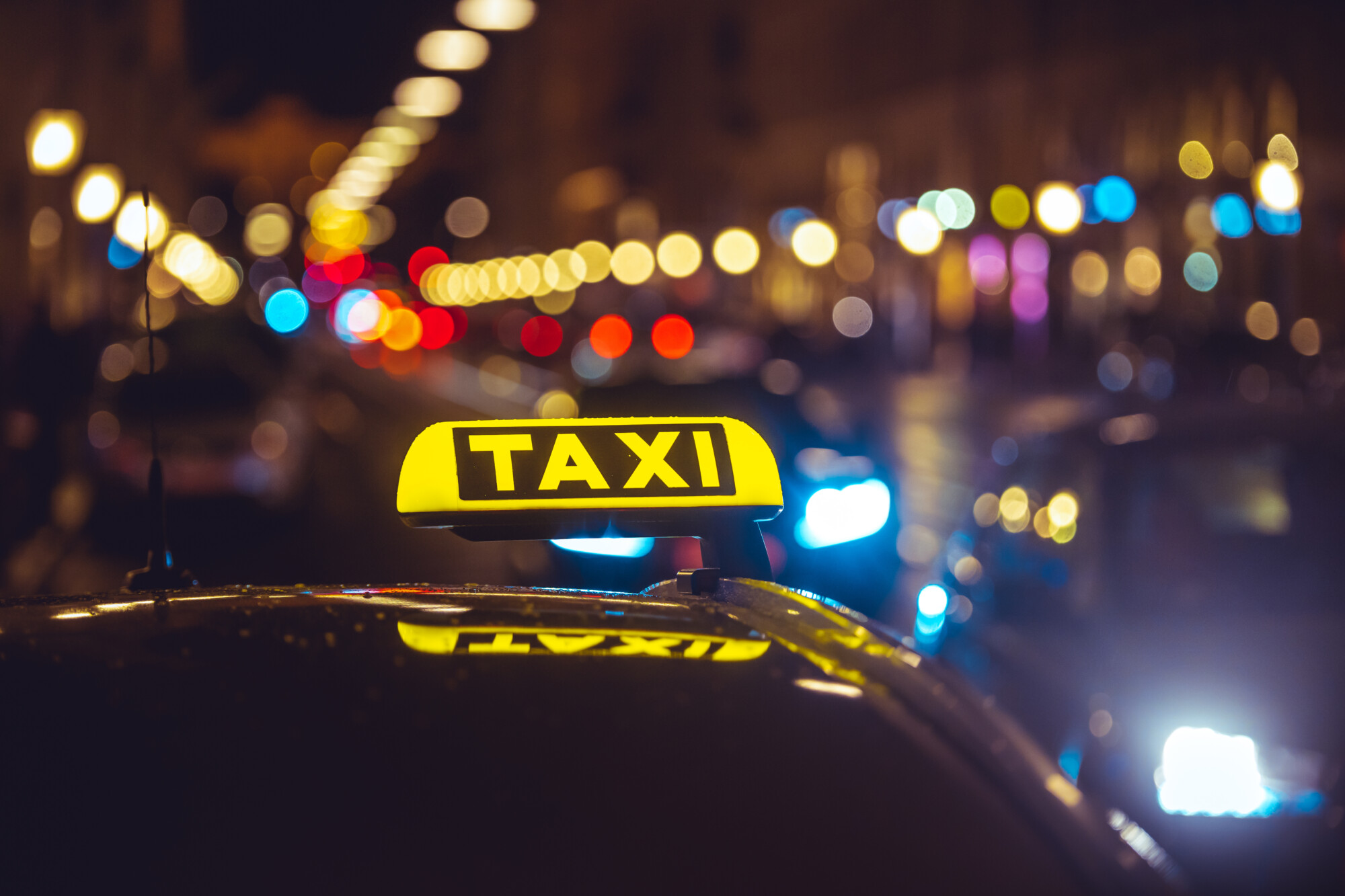 Taxi sign representing ride-hailing services affected by VAT ruling
