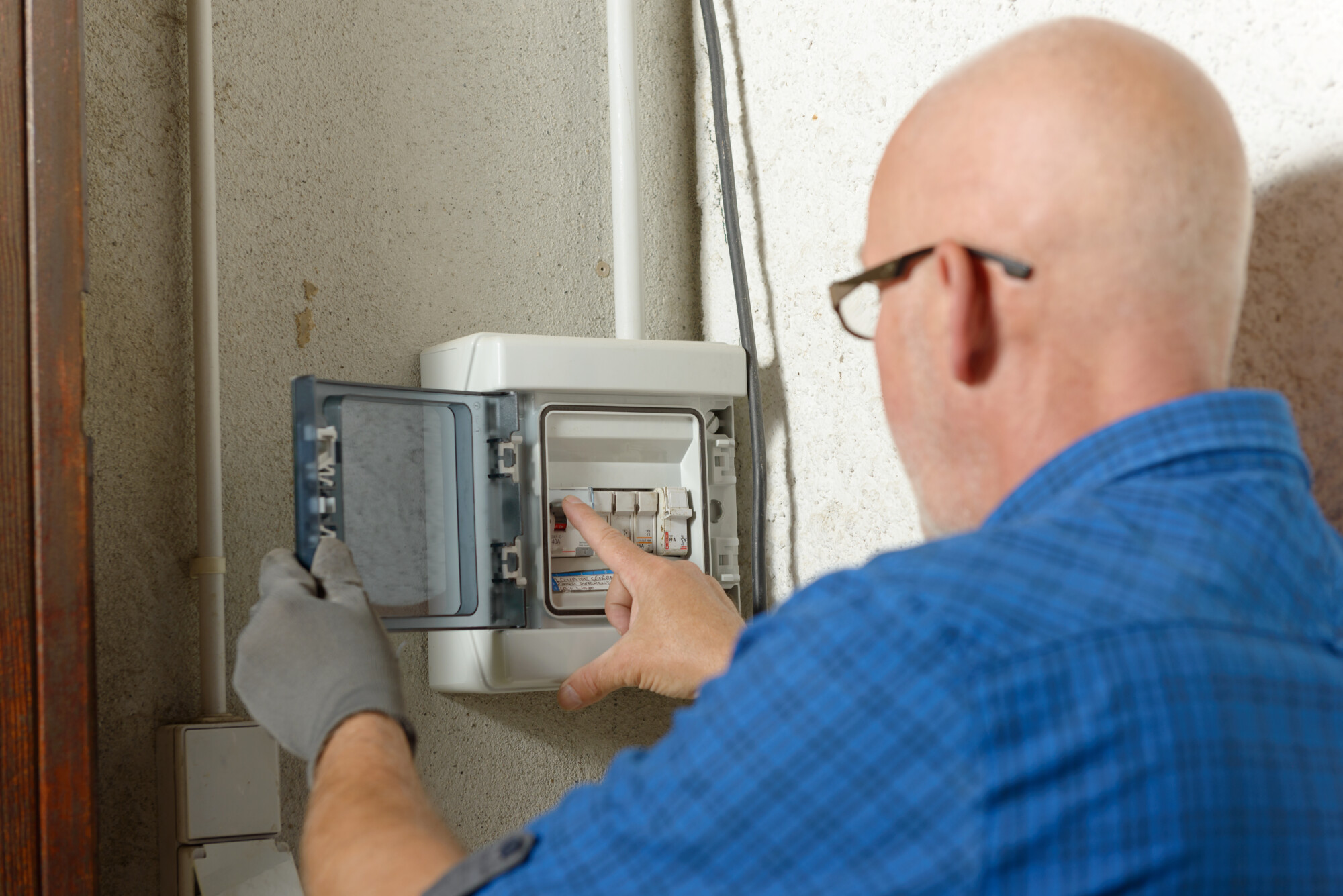Homeowner checking electricity meter ahead of VAT rate cut