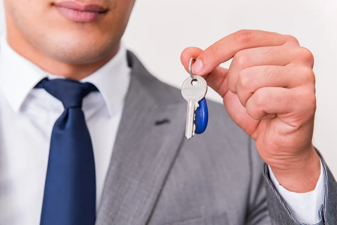 Landlord holding property keys with rental income under HMRC scrutiny